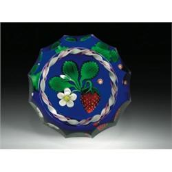 James Kontes strawberry paperweight, with a bright red strawberry, a white blossom and bud, and...