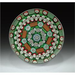 Paul Ysart magnum patterned millefiori paperweight, with rings of complex canes in green, maroon...