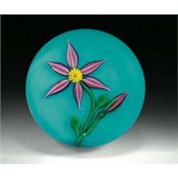 Charles Kaziun, Jr. stylized flower paperweight, with a flower composed of six, white-striped, m...
