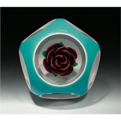 Charles Kaziun, Jr. double overlay crimp rose paperweight, containing an upright, dark red, crim...