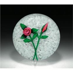 Charles Kaziun, Jr. red rose paperweight, composed of a crimson cabbage rose and a red bud, on l...