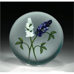 Chris Buzzini lilacs paperweight, with two sprays of lilacs, one white and one in shades of purp...