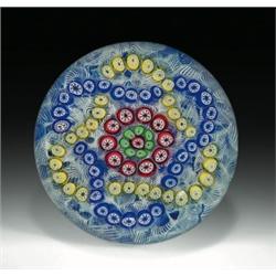 Baccarat 1979 millefiori garlands paperweight, composed of two interlaced trefoil garlands, one...