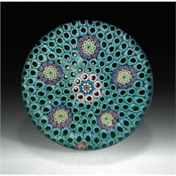 Cristal Saint-Louis 1986 millefiori and carpet ground paperweight, composed of a central cluster...