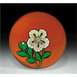 Cristal Saint-Louis 1973 paperweight, with a white flower composed of five ruffled, millefiori pe...