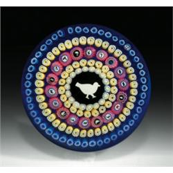 Baccarat 1979 Gridel pigeon paperweight, with a central pigeon silhouette cane, encircled by ring...