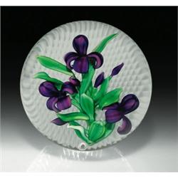 Ray Banford iris paperweight, with three dark purple iris, three purple buds, and winding green l...