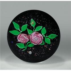 Ray Banford cabbage rose paperweight, containing two, multi-petal, pale pink roses, on stems wit...