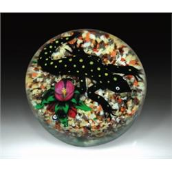 Bob Banford salamander paperweight, composed of a yellow-spotted black salamander, crawling near...