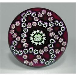 Parabelle Glass quatrefoil millefiori garlands paperweight, with a central white and green rose,...