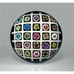 Parabelle Glass pansy and rose chequer paperweight, with an assortment of thirteen pansy canes i...