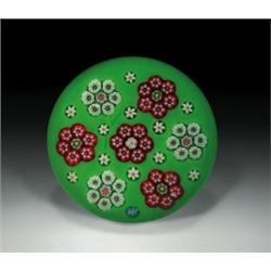 Parabelle Glass millefiori paperweight, containing a spaced ring of six circlets of red and whit...