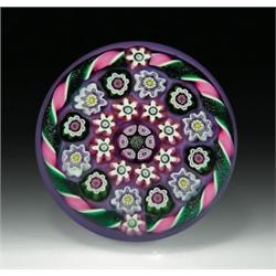 Julie Scrutton Lewis concentric millefiori paperweight, with a bundled center cane in purple and...