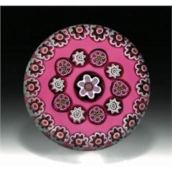 Julie Scrutton Lewis spaced concentric millefiori paperweight, with a pink edelweiss center cane,...