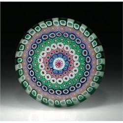 Drew Ebelhare close concentric millefiori paperweight, with a central signature cane, encircled...