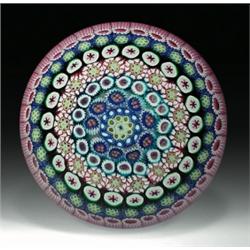 Drew Ebelhare close concentric millefiori paperweight, with canes in blue, red, pink, green, tur...