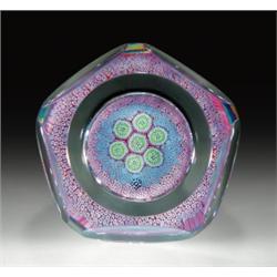 Whitefriars 1975 millefiori carpetground paperweight, with a central cluster of seven bundled ro...