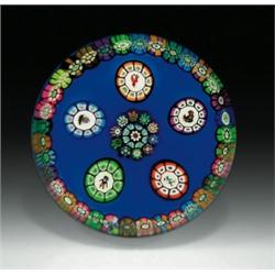 Perthshire Paperweights 1982 "Nursery Rhyme" portrait cane and millefiori paperweight, with a ce...