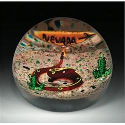 William Manson desert snake paperweight, with a yellow-striped red aventurine snake, coiled betwe...