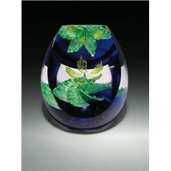 Caithness Glass "Cactus Reflection" high-domed abstract design paperweight, with a yellow flower...