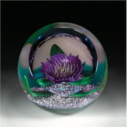 Caithness Glass "Tropicana" 1996 Collectors' Club Paperweight, with a large, upright, dark purple...
