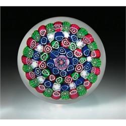 Baccarat concentric millefiori paperweight, with a central red, blue, and white cane, encircled...