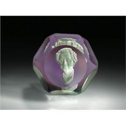 Baccarat 1973 Evangeline Bergstrom sulphide paperweight, with a white cameo on translucent ameth...