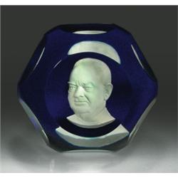 Baccarat President Herbert Hoover sulphide paperweight, containing a white cameo on translucent...