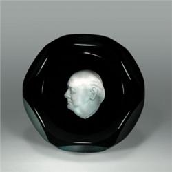 Baccarat 1954 Winston Churchill sulphide paperweight, with a white cameo on translucent cranberry...