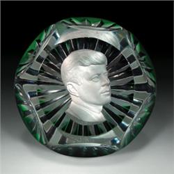 Baccarat President John F. Kennedy sulphide paperweight, having a white cameo on green-edged, dia...