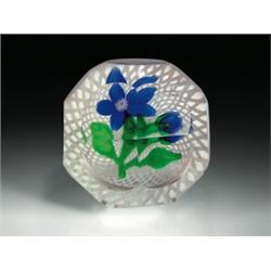Chinese floral paperweight, with a blue clematis flower, having a white millefiori center, a blue...
