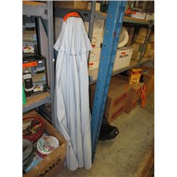 Used blue patio umbrella