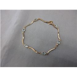 Oval-cut Blue Topaz & Diamond Tennis Bracelet