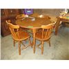 Image 1 : Used round wood dining table with 4 chairs