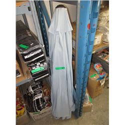 Used blue patio umbrella