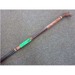 Folk art walking stick with a rhino head handle