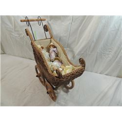 SMALL WICKER ANTIQUE STYLE CARRIAGE W/ MINI DOLLS