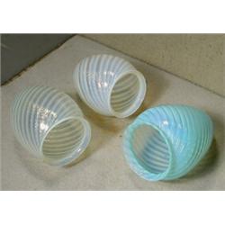 Three Opalescent Glass Electric Shades, These three tear drop swirl shades are 5" high and take...