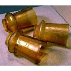 Set of Three Electric Shades, These three decorated amber electric light shades that are 5.75"...