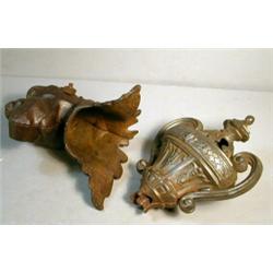 Two, Pieces of Fancy Iron, The animal figure holding the large object in its mouth is from a...