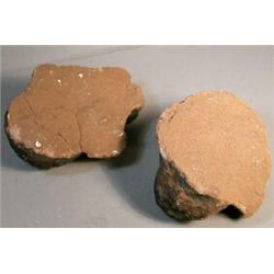 Two Carved Brownstone Faces, These hand carved brownstone faces measure 9" x 7" and are 4" thic...