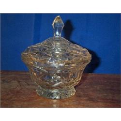 A PAIR OF CIRCULAR CUT GLASS PRESERVE JARS AND COVERS, 19th CENTURY, with serrated rims, 15cms...