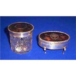 A SILVER MOUNTED TORTOISESHELL DRESSING TABLE BOX, LONDON 1929; an oval example with tortoiseshel...