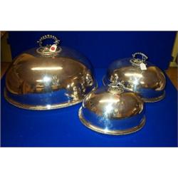 A SET OF FIVE GRADUATED PLATED MEAT DISH COVERS, with beaded handles and rims, engraved with the...