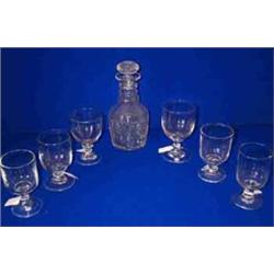 A HEAVY CUT GLASS DECANTER, 19th CENTURY, with three faceted neck rings, thick shoulder facets, p...