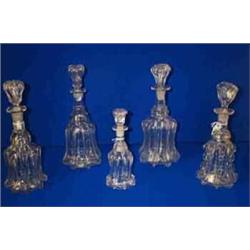 FIVE HEAVY MOULDED BLOWN TAVERN DECANTERS, MID 19th CENTURY, PROBABLY NEWCASTLE, 33cms high and...