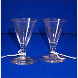 TWO SMALL TRUMPET DRAM GLASSES, c.1745-50, on folded feet, each 8cms high, £120/180...