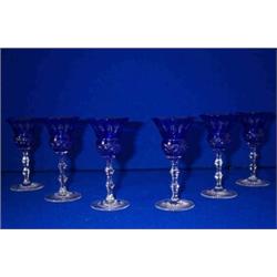 A SET OF SIX BRILLIANT CUT BLUE SHERRY GLASSES, EARLY 20th CENTURY, the faceted stems with two kn...