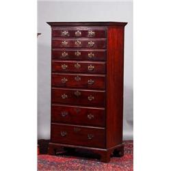 A MAHOGANY TALL BOY, IRISH, 18th CENTURY, fitted with eight graduating long drawers on bracket fe...