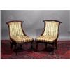 Image 1 : A PAIR OF ROSEWOOD SPOON BACK LIBRARY CHAIRS, c.1830, with moulded crest rails, upholstered backs...